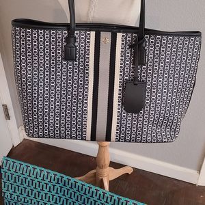 Tory Burch Black tote Coated canvas Printed link pattern.